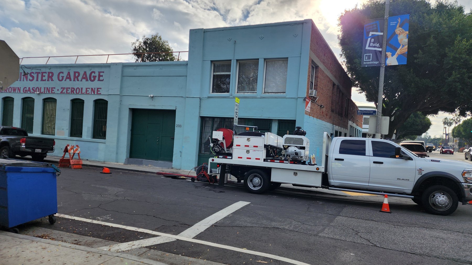 Anytime Rooter truck at a commercial garage property