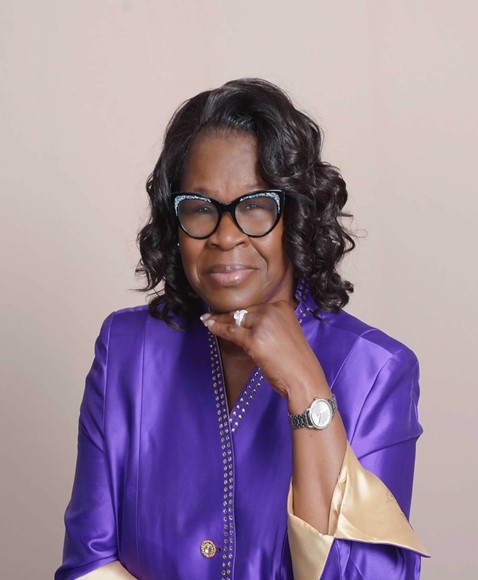 Bishop Sandra V. Miller in episcopal purple robes