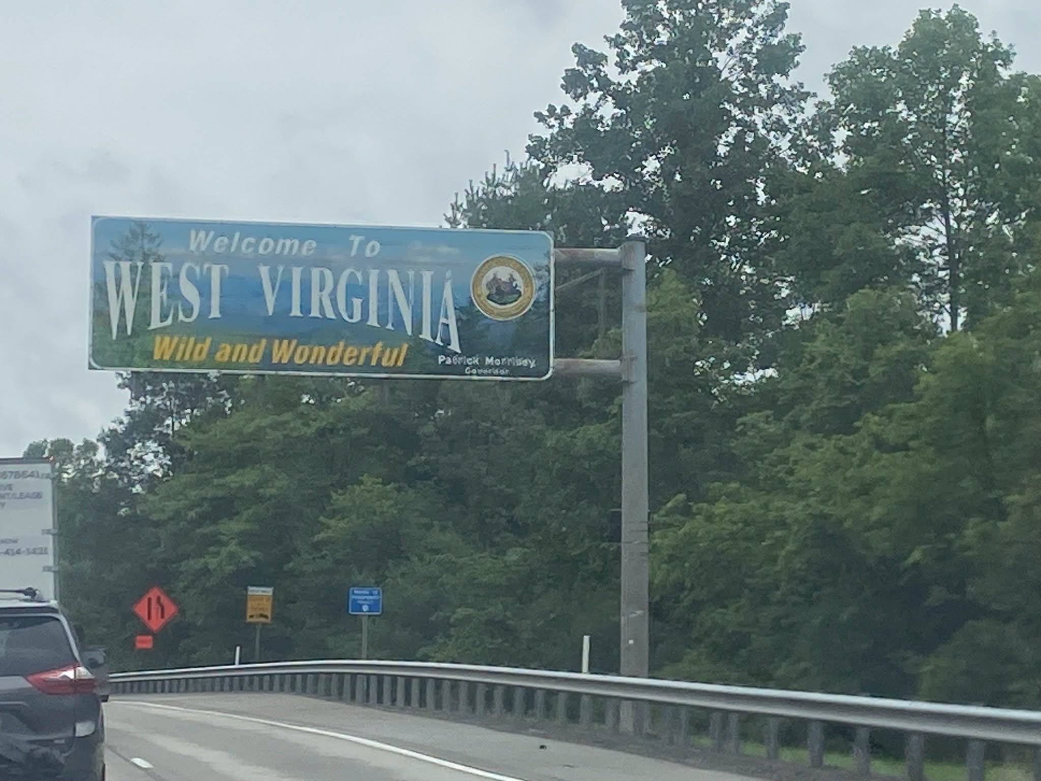 Welcome to West Virginia sign on the drive to college move-in.