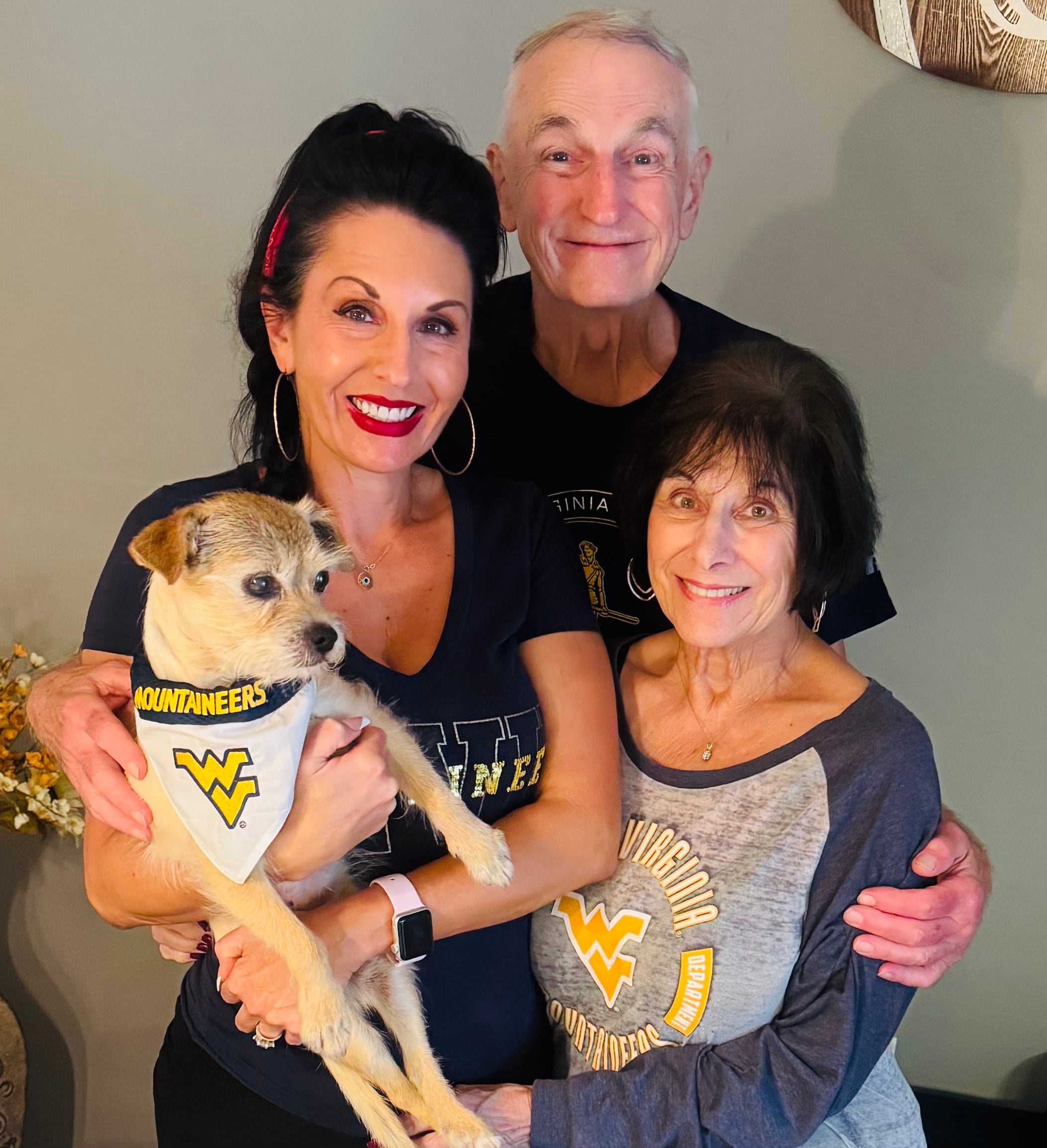 Stacey Creely with her parents and family dog at home.