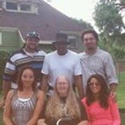 The Diggs family outdoors near a house