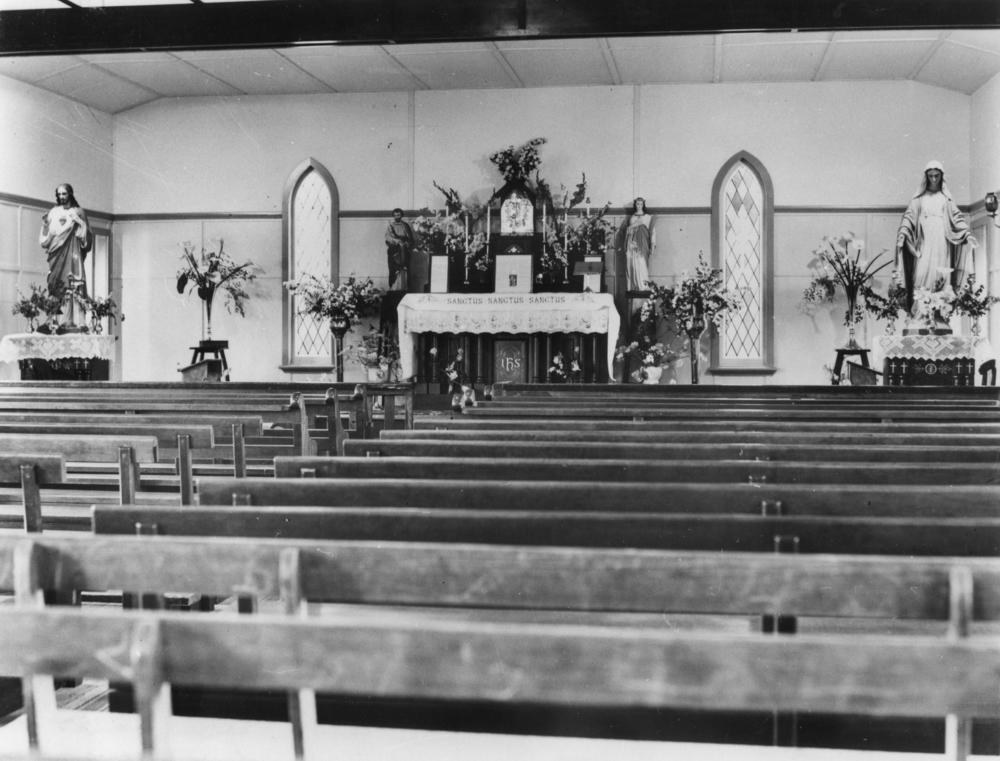 Historic Catholic chapel with pews facing the altar