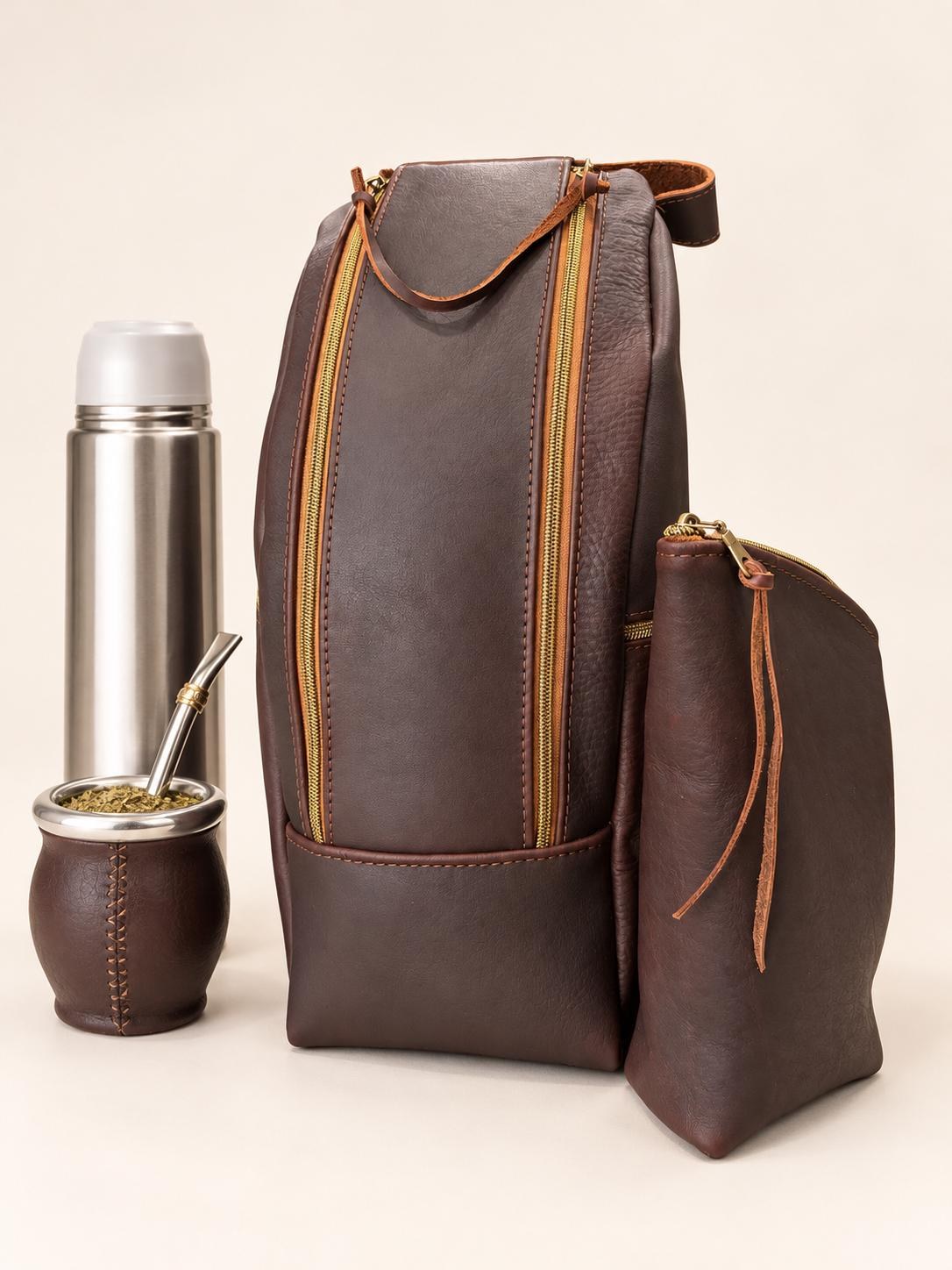 Handmade leather mate backpack with a thermos, mate gourd, and matching yerba holder