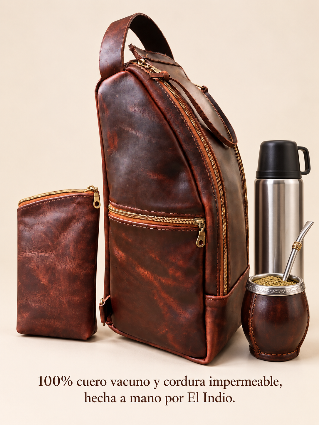 Brown leather mate backpack and matching yerbera with golden zippers, beside a thermos and mate gourd