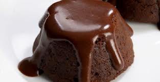 A rich chocolate lava cake with molten chocolate oozing out.