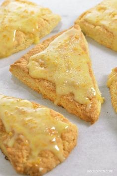 Golden, triangular scones with a sugar glaze.