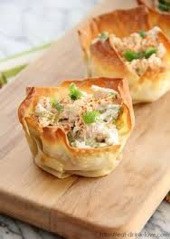 Mini chicken pot pies with flaky crust and creamy filling.