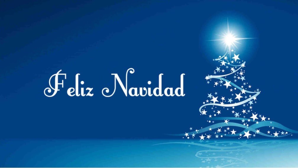 Elegant blue Christmas card with a white glowing tree and 'Feliz Navidad' text.