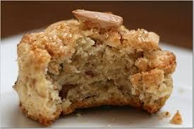 Close-up of a partially eaten oatmeal cookie with a walnut piece.