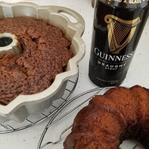 Two chocolate bundt cakes next to a can of Guinness stout.