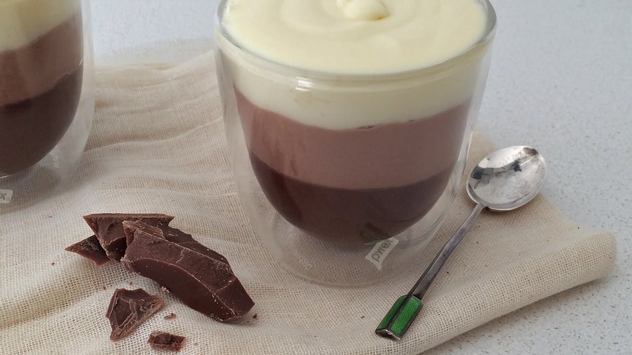 Layered chocolate mousse dessert with three distinct creamy layers.