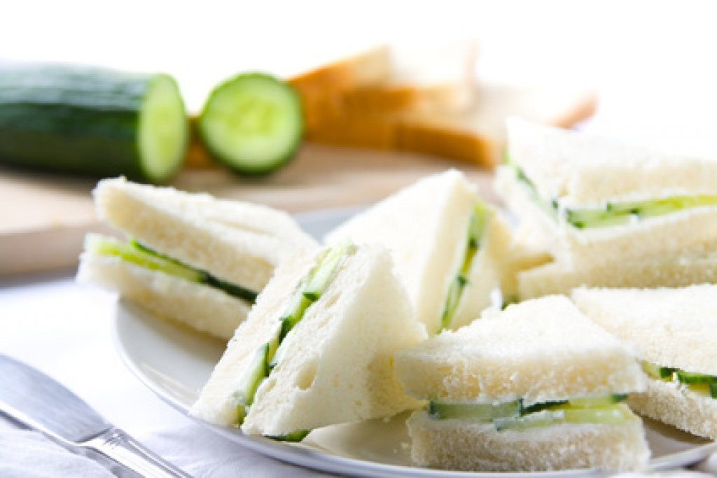 Plate of cucumber tea sandwiches with crusts removed.