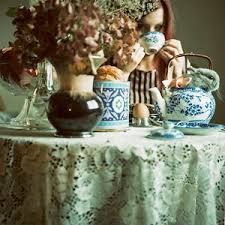 A vintage table setting with porcelain and dried flowers.