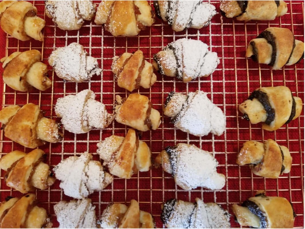 Assorted homemade cookies cooling on a wire rack.