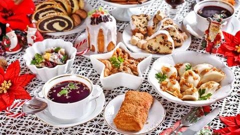 A festive table with traditional Easter foods and a decorated cake.