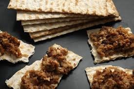 Pieces of matzah topped with a spiced meat mixture.