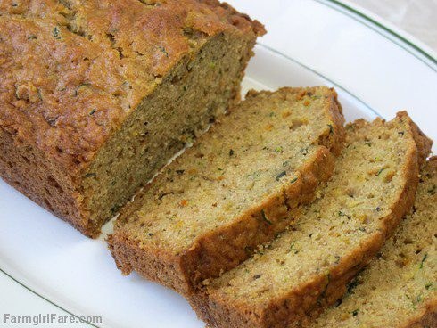 Sliced banana bread on a white plate.