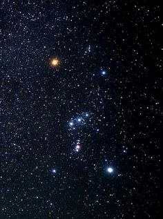 Bright stars scattered across a night sky with a prominent constellation.