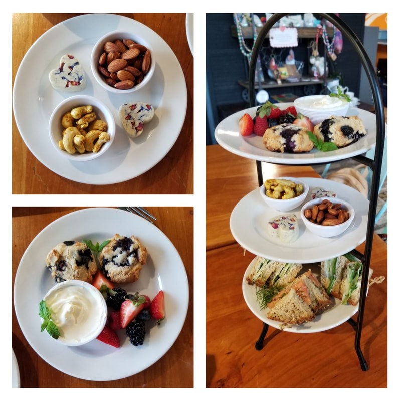 A multi-tiered afternoon tea set with assorted snacks and desserts.
