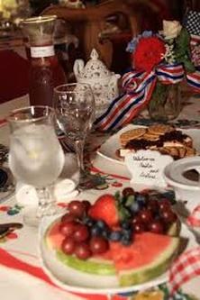 Table set with dessert, fruit, and beverages for a celebration.
