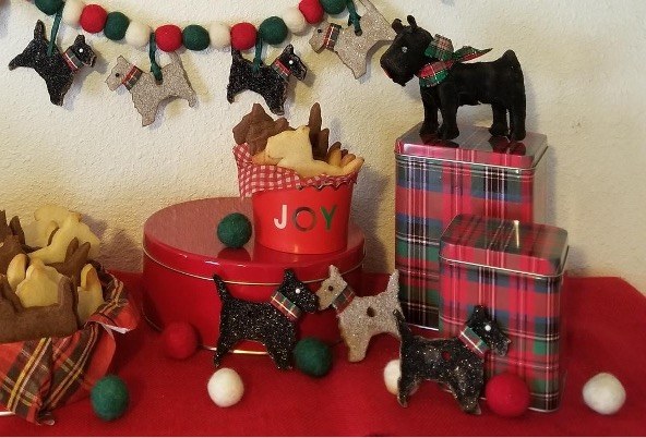 Festive dog-themed decorations with cookies displayed.