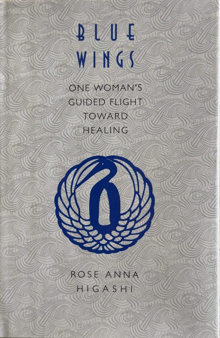 Book cover with a blue emblem and title about a woman's healing journey.