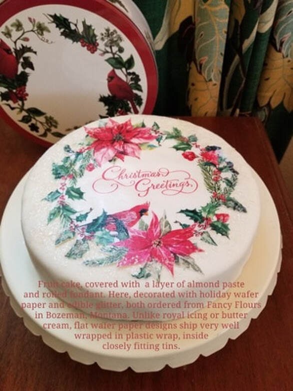 A beautifully decorated Christmas cake with festive floral designs.