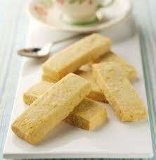 Close-up of traditional Indian sweet barfi pieces on a plate.