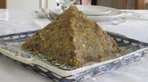 A pyramid-shaped mound of food on a plate.