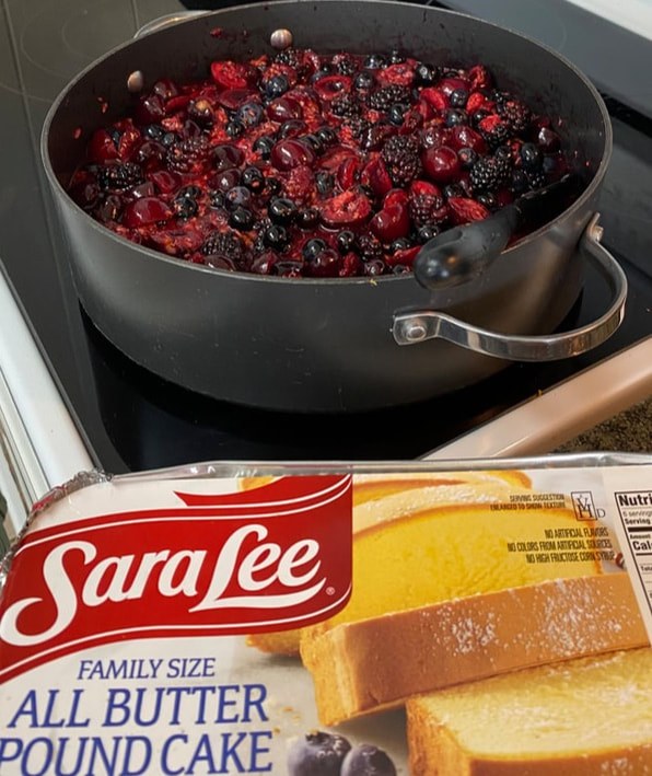 Sara Lee butter and a pot of mixed berries on the stove.