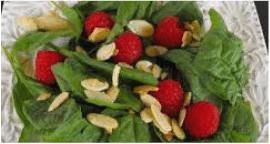 Fresh spinach salad with strawberries and almond slices.