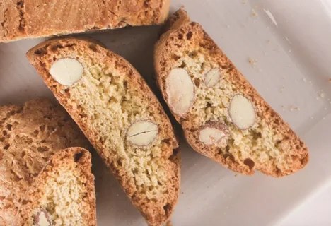 Close-up of almond biscotti slices with visible almond pieces.