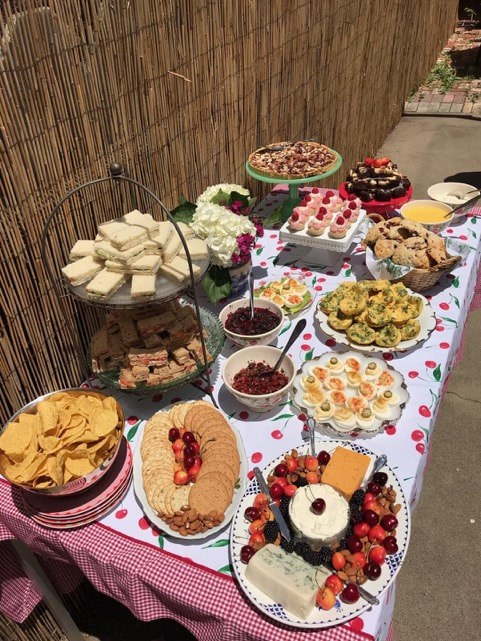 A festive table filled with assorted appetizers and desserts.