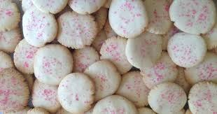 Close-up of round cookies with pink sprinkles.