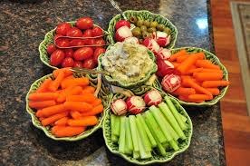 Assorted fresh vegetables arranged in woven baskets.