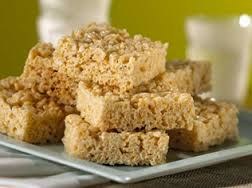 Stack of homemade rice crispy treat squares on a plate.
