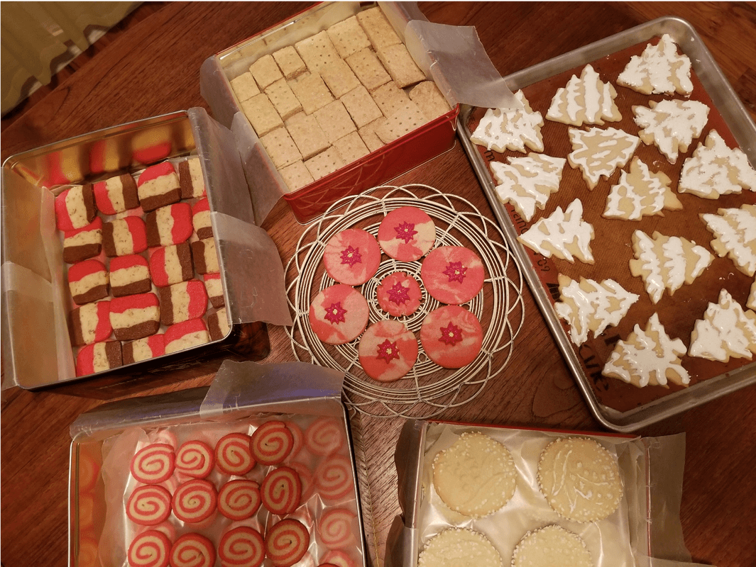 An assortment of colorful, decorative desserts arranged on a table.