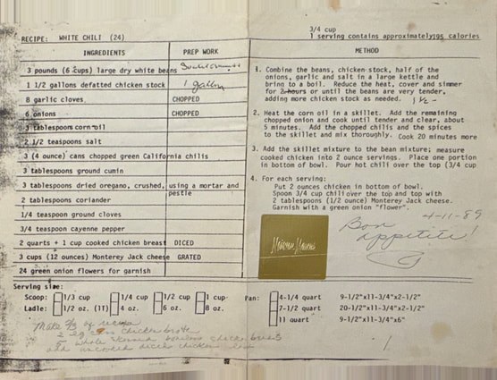 A vintage document detailing a chemical experiment with handwritten notes and a small photo.