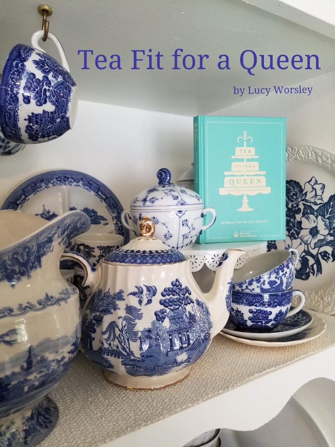 Blue and white porcelain tea set with a book, elegant tea setup.
