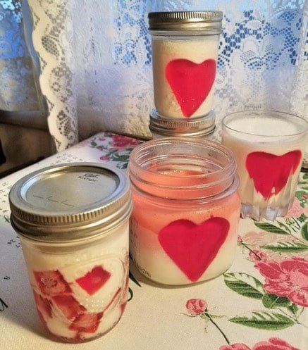 Three jars with heart decorations, creating a cozy, romantic vibe.