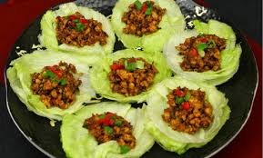 Lettuce cups filled with seasoned minced meat and vegetables.