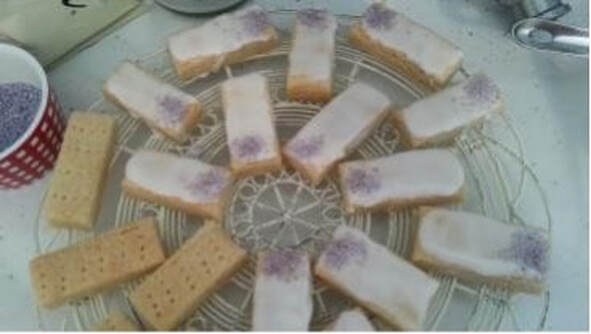 Biscuits with a creamy filling arranged on a lace doily.