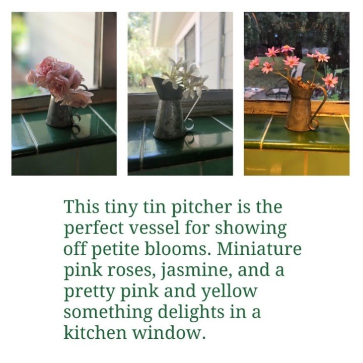 A tiny pitcher holding miniature pink roses on a windowsill.