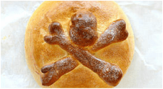 Bread loaf with a skull and crossbones design on top.