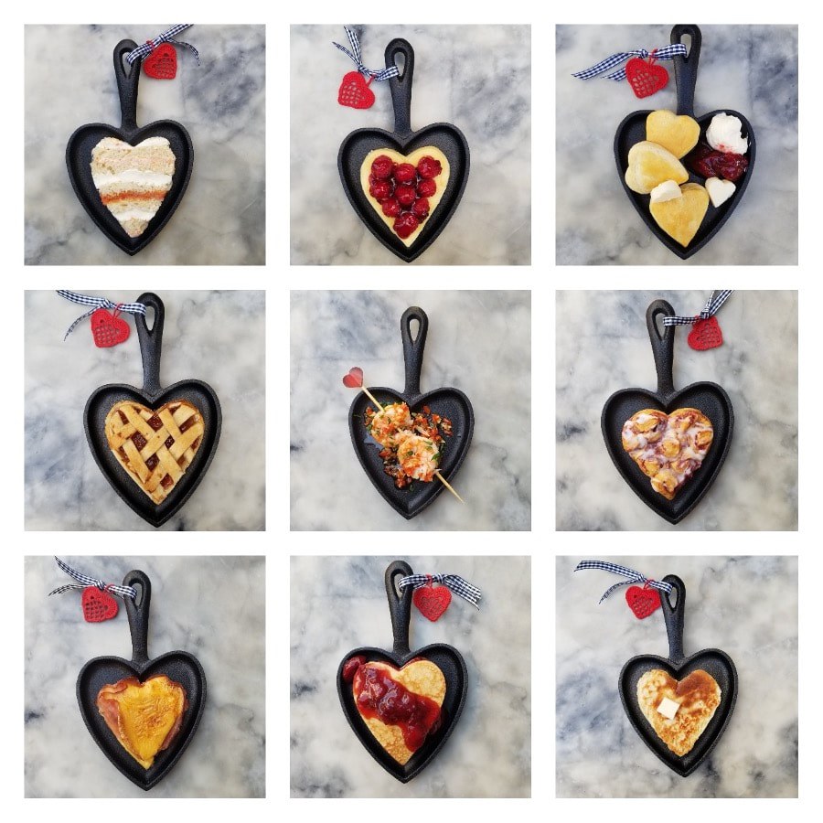 Nine heart-shaped pizzas with various toppings on a gray surface.