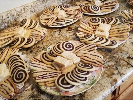 Assorted cookies arranged on plates.