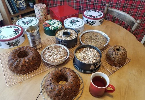 Homemade cakes with oats and a cup of tea on a cozy table.