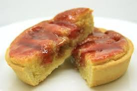 Two pieces of moist cake with a glossy caramel topping.