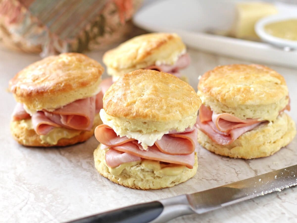 Ham and cheese biscuit sandwiches with mayonnaise.