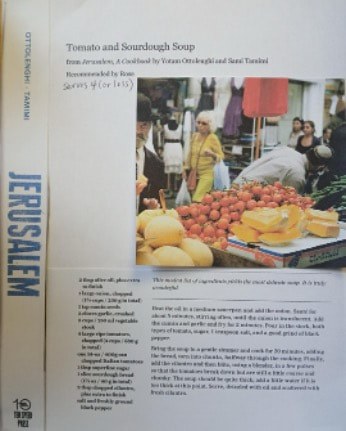 Market scene in Jerusalem with vendors and fresh produce.